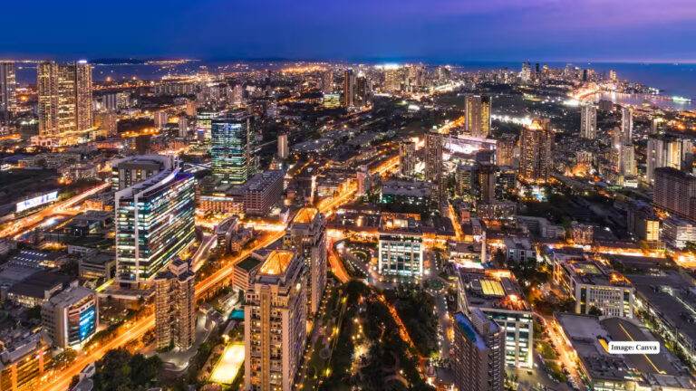 Aerial night view of Mumbai city with skyscrapers and illuminated roads