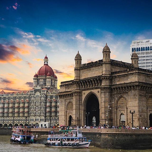 Gateway of India and Taj Mahal Palace Hotel in Mumbai with ferries at the waterfront — Travel content by Ajjay Bhagyakar.